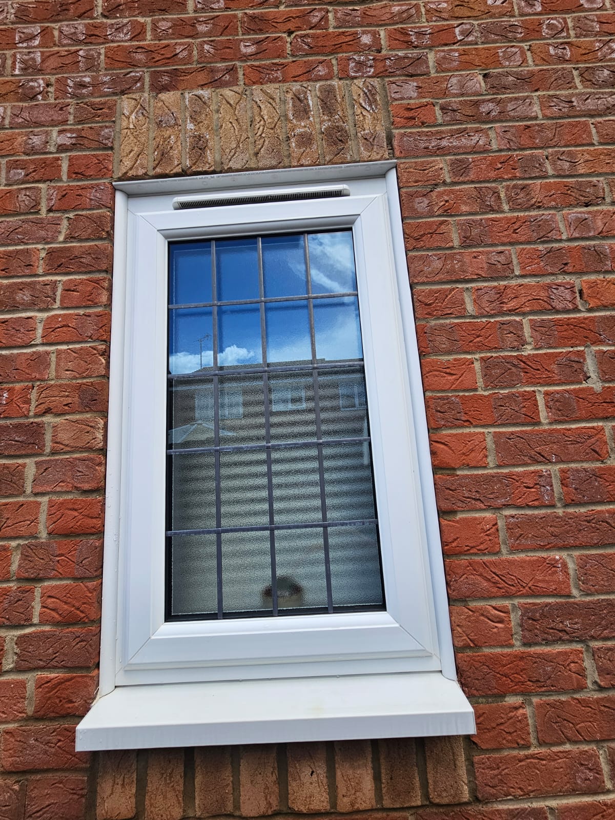 After window cleaning showing clean glass, frame and sill