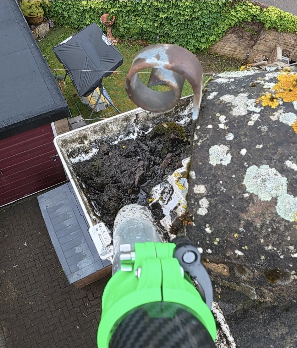 Before gutter vacuum clearing by LARC Exteriors